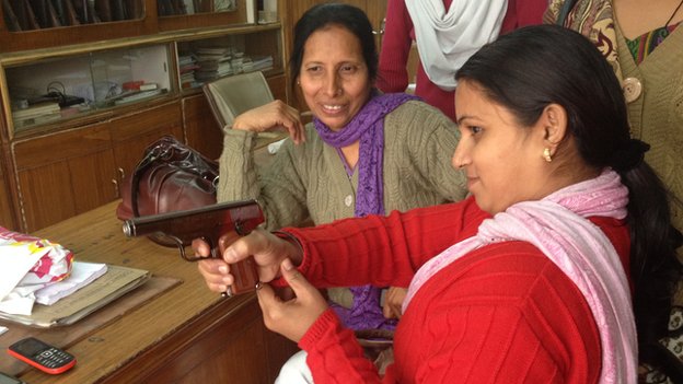 Indianwoman with gun